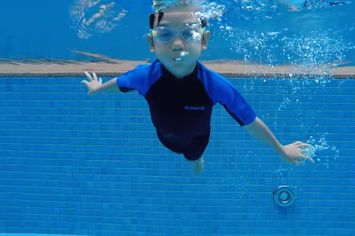 Kids enjoying fun and engaging swimming classes at Florida Swim Center, designed to build confidence and water skills.